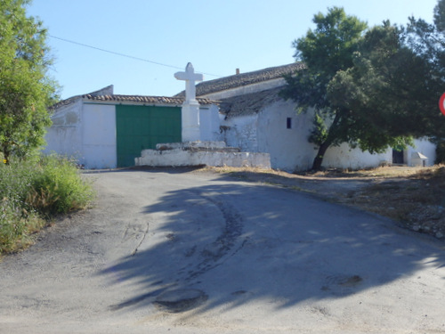 Church and Agriculture Looking Buildings on a Hilltop.